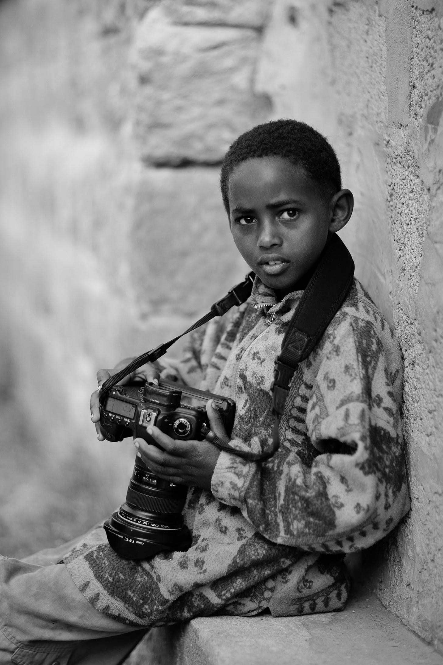 Street boy with camera. © Gavin Gough. 1/2000, ƒ1.2, ISO 100, 85mm