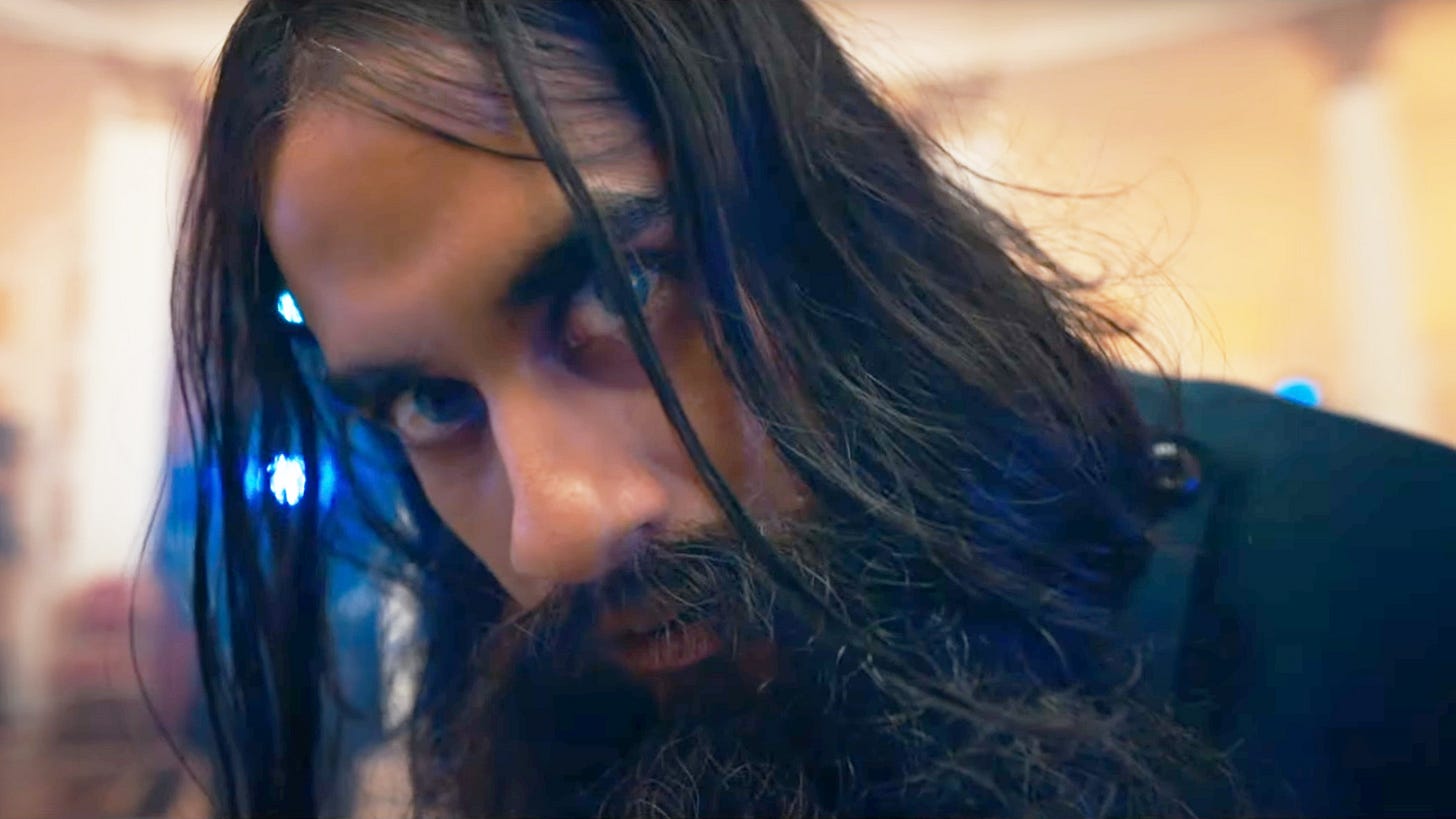 This image shows a close-up shot of the Master (played by Sacha Dhawan) dressed as Russian mystic Grigori Rasputin in Doctor Who Series 13's ninth episode, "The Power of the Doctor." This image shows a close-up shot of the Master (played by Sacha Dhawan) dressed as Russian mystic Grigori Rasputin in Doctor Who Series 13's ninth episode, "The Power of the Doctor."