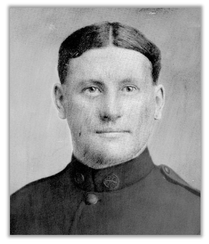Headshot of Regan in uniform.  The photo is a black and white, grainy photo. Regan has a partial smile on his face.