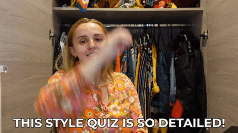 Hannah sitting in front of her wardrobe, saying, "This style quiz is so detailed!"