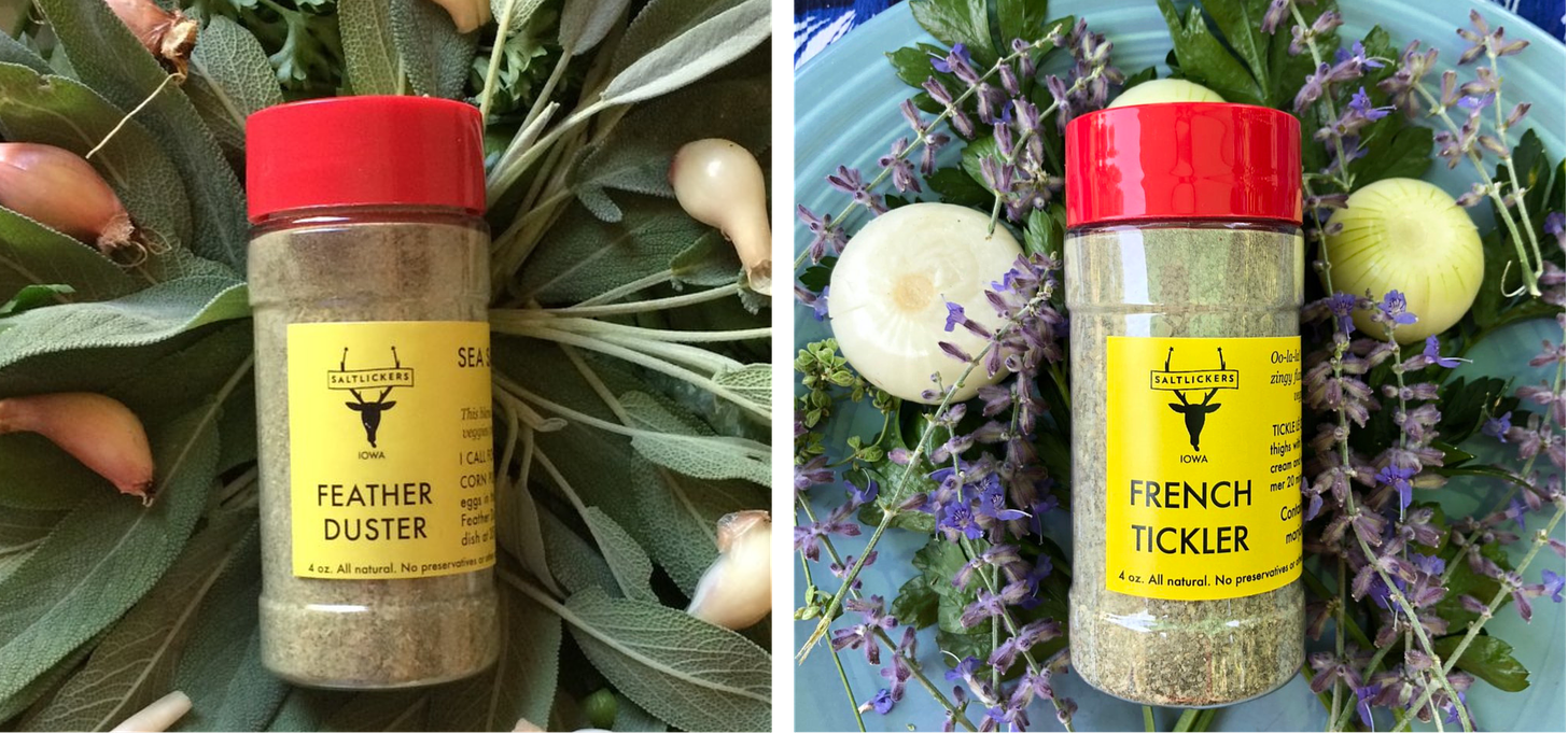 Left, a bottle of the Feather Duster spice blend resting on a pile of sage and shallots. Right, a bottle of the French Tickler spice blend resting on lavender and onions