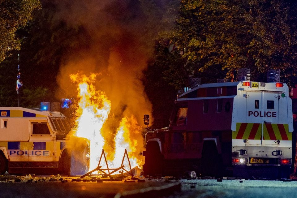 Police vehicles are targeted during disorder in Sandy Row on Monday (Picture: Kevin Scott)