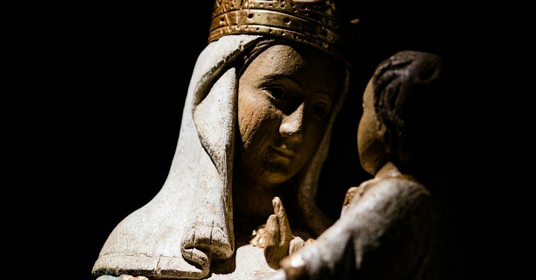 a statue of a woman holding a child a statue of a woman holding a child