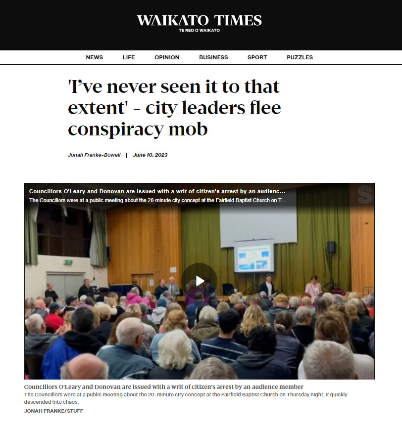 A screenshot of the headline of the Waikato Times which says "'I've never see it to this extent' - city leaders flee conspiracy mob" with a video clip still from inside the public meeting.