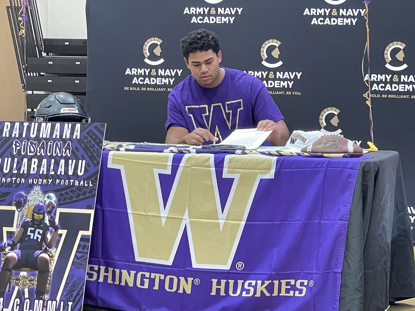 Ratumana “Mana” Bulabalavu of the Army-Navy Academy signs his National Letter of Intent on Wednesday to play college football at the University of Washington. Steve Puterski photo