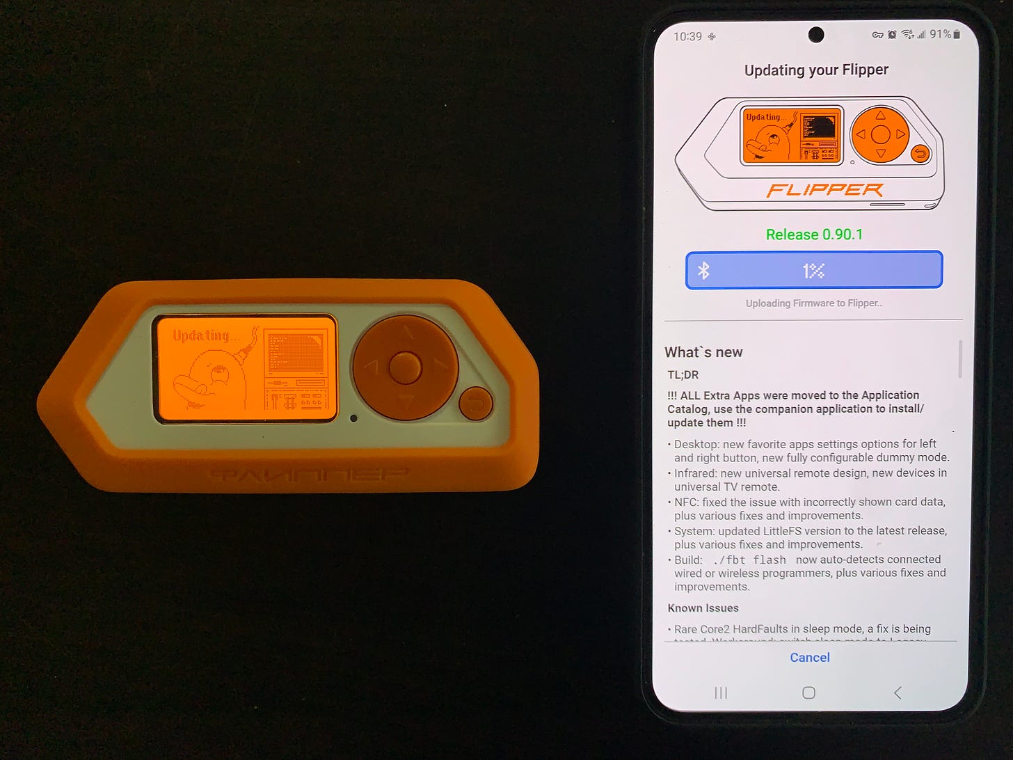 A photo of a Flipper Zero device with an orange case being updated by an Android phone next to the device.