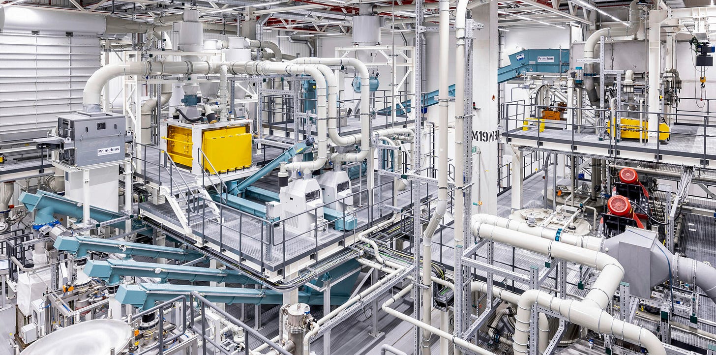 A photo of a battery recycling factory—it's a mass of metal tubes and pipes and reactors.
