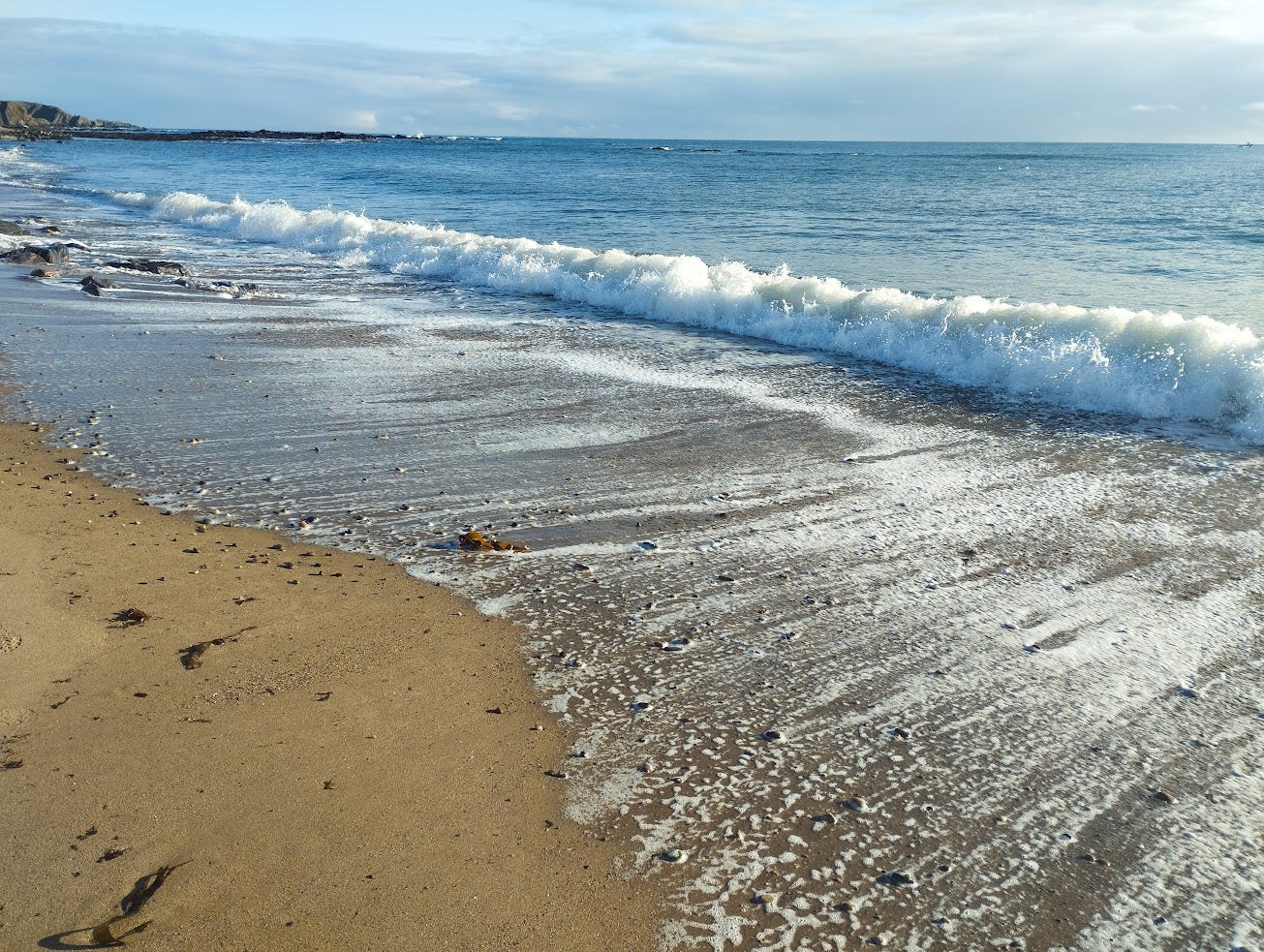 waves crashing on Stonehaven beach in the winter sunshine