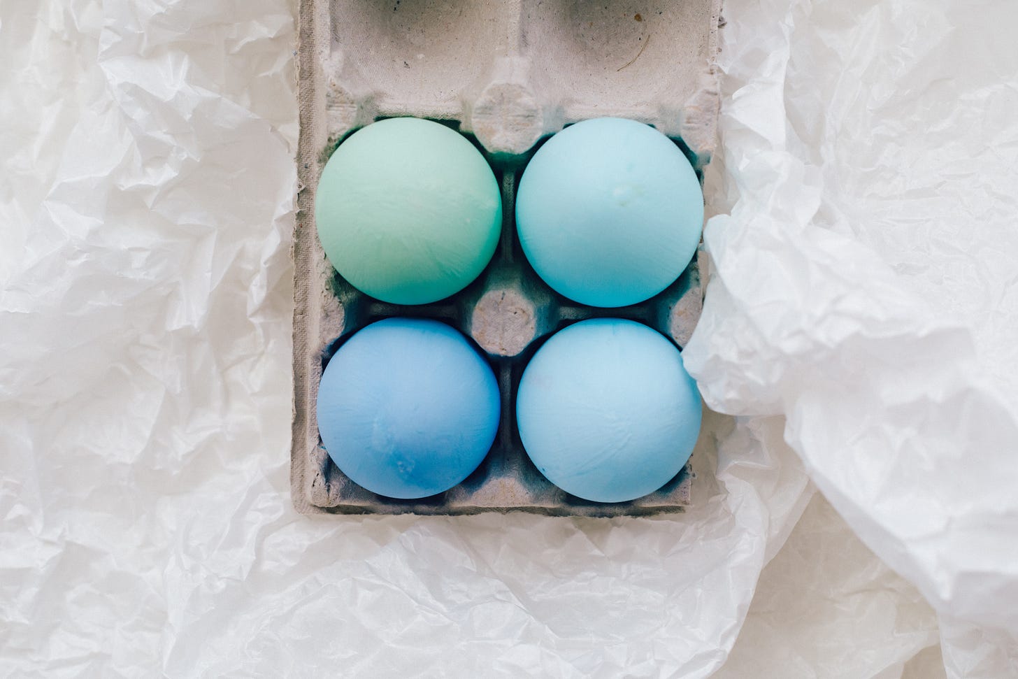 A carton of blue chicken eggs.