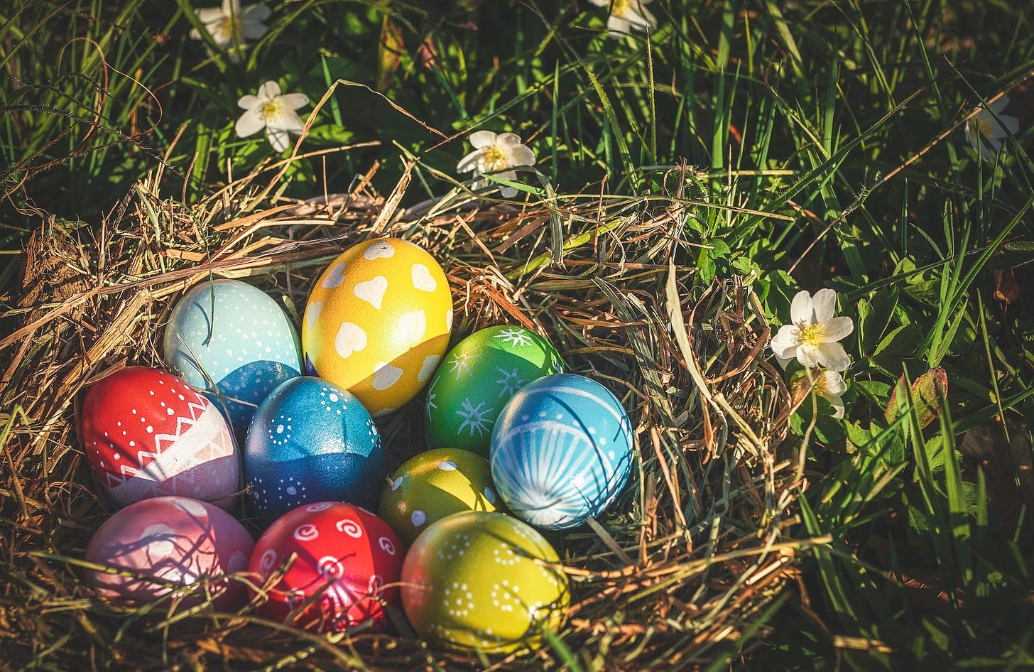 Colorful Easter eggs on a bed of grass