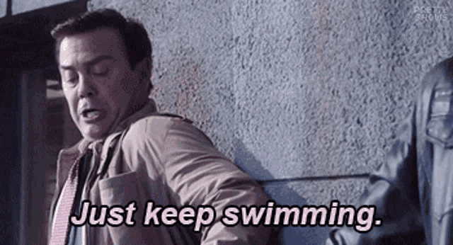 GIF from Brooklyn 9-9 of Boyle, Peralta, and Pimento telling each other "Just keep swimming." as they creep along a ledge to get back inside a building.