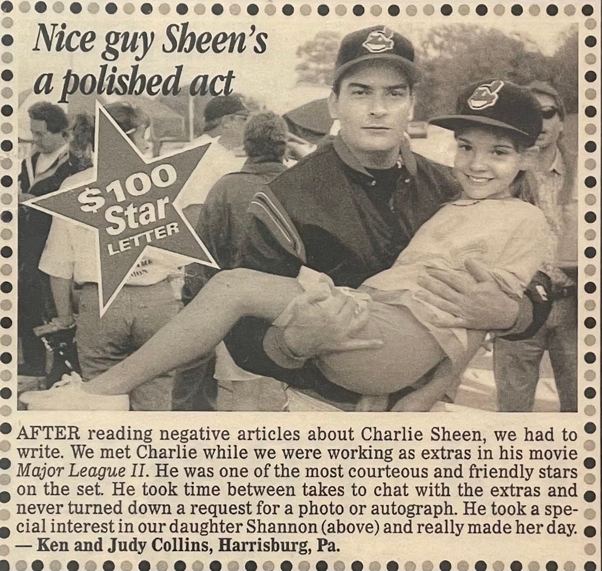 A photo of Charlie Sheen holding me while working on the set of Major League II.