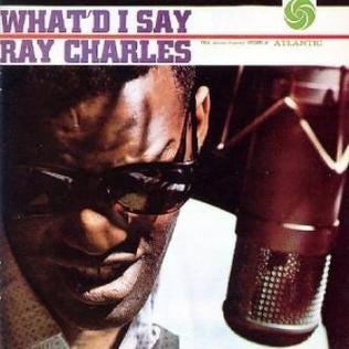 Cover of Ray Charles’s What’d I Say. Charles is singing directly into a microphone.