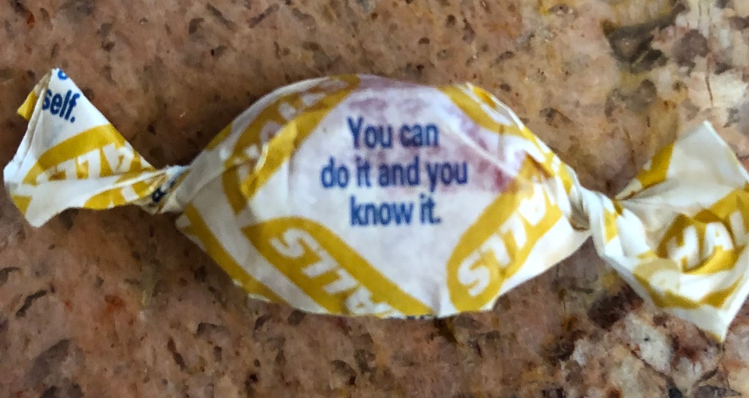 A cough drop with a wrapper that says, “You can do it and you know it.”