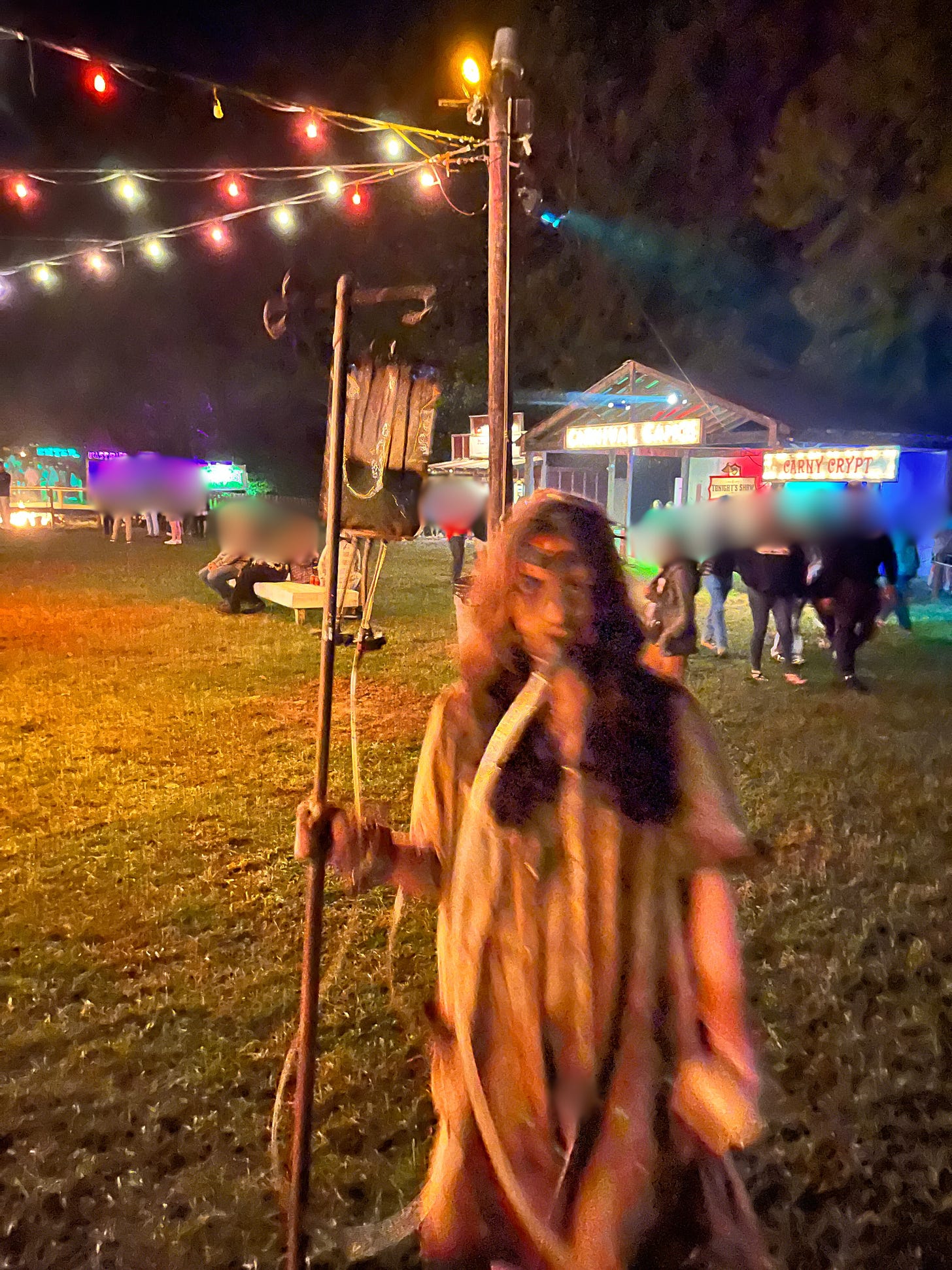 An oxygen mask-wearing grunge patient roams the Panic Point grounds rolling her IV bag stand along with her.