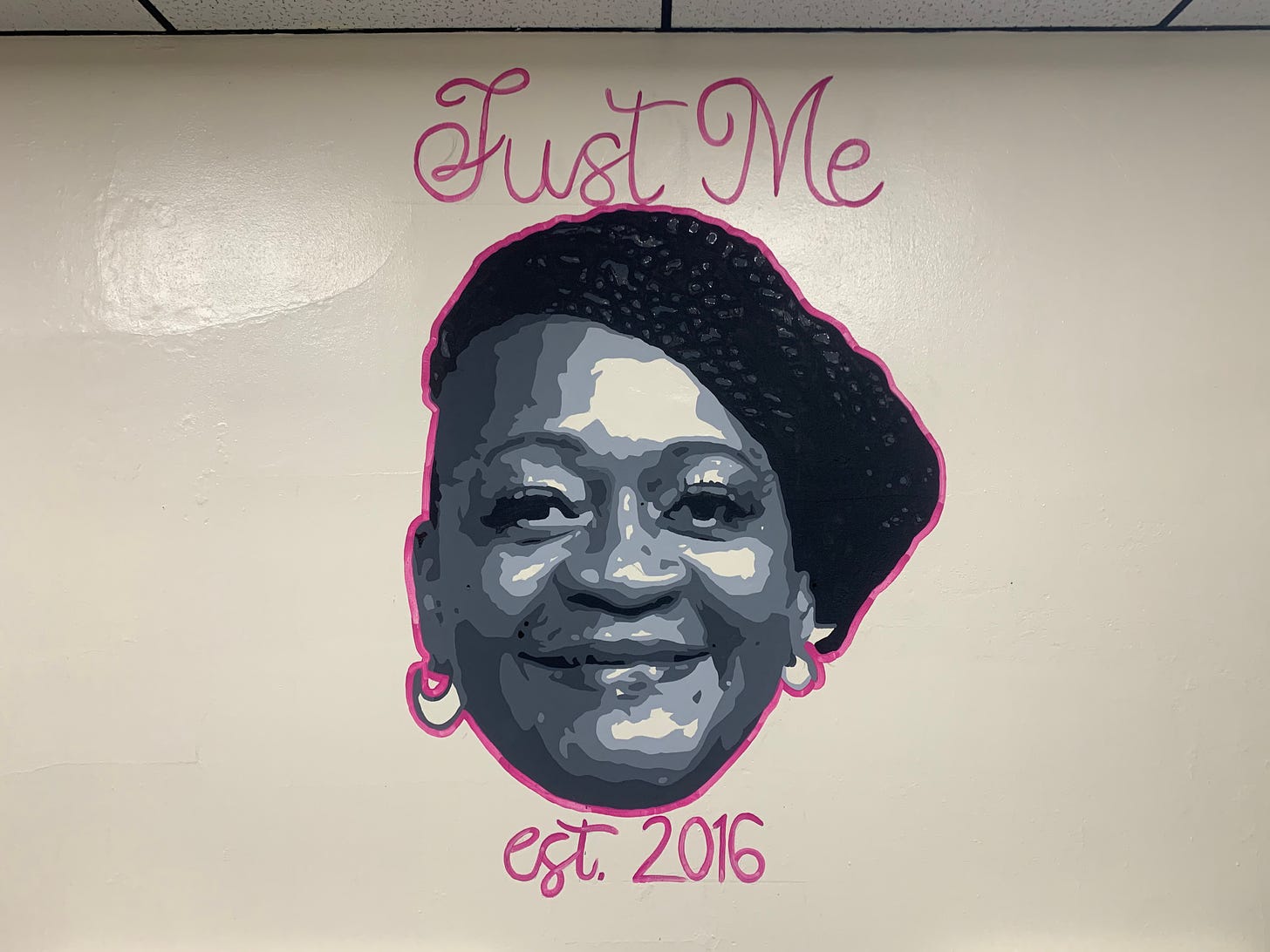A mural depicting the face of Ms Rica Dabney. Above her says "Just Me" and below her says "est 2016"