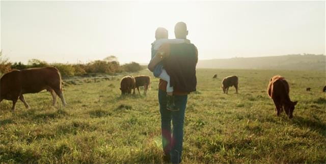 whole cows man with child.jpg