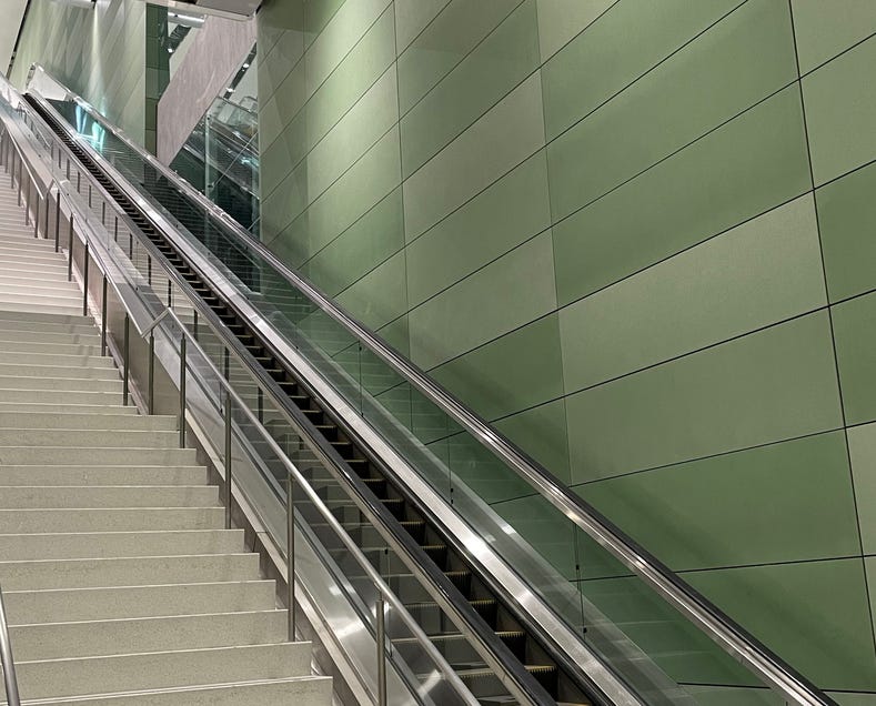 photo showing the long up stairs and escalator