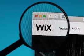 WIX logo under magnifying glass ...