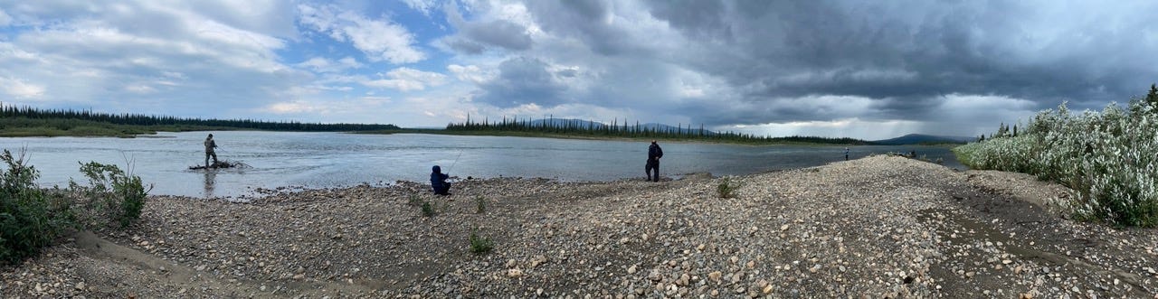 People fishing on Kobuk River in Alaska