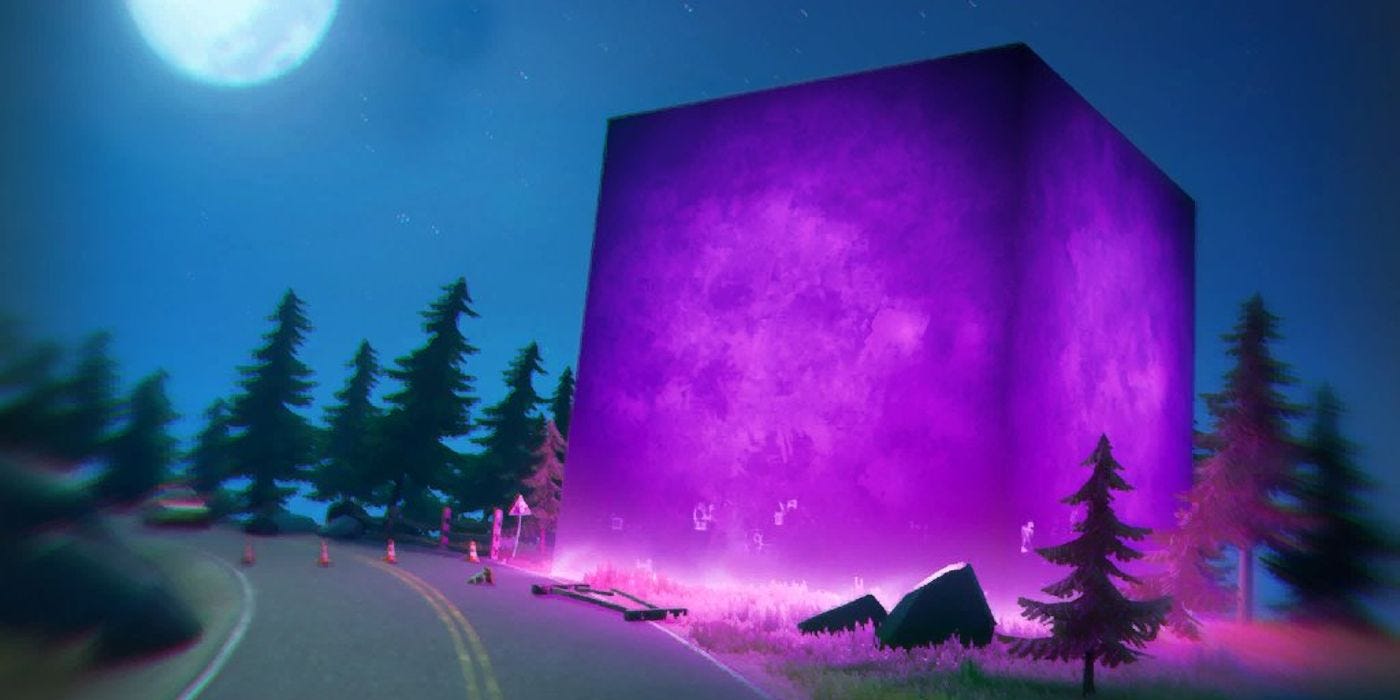 A large purple cube by the side of the road