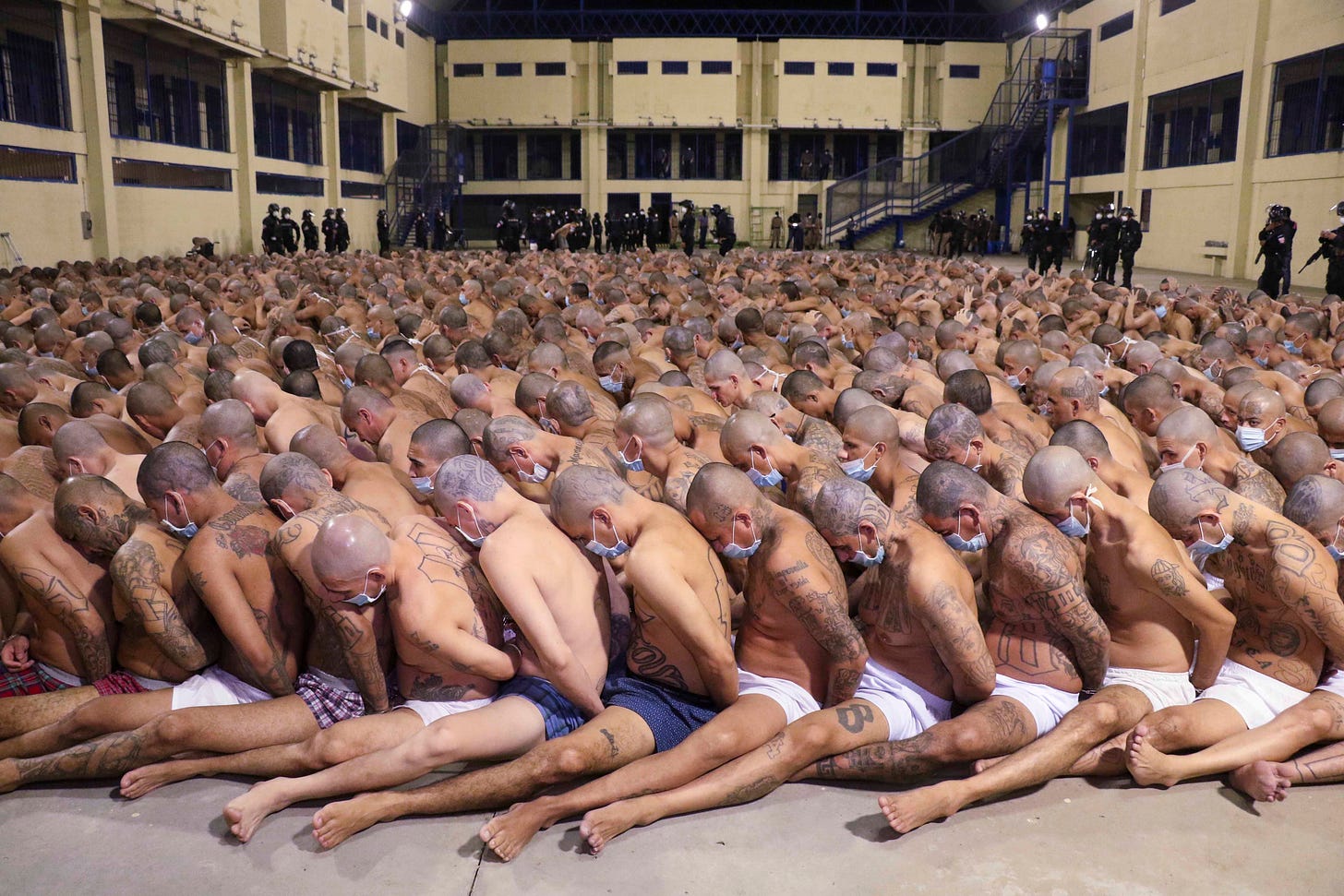 Inmates are lined up during a security operation under the watch of police at Izalco prison in San Salvador, El Salvador, on April 25, 2020. Inmates are lined up during a security operation under the watch of police at Izalco prison in San Salvador, El Salvador, on April 25, 2020.