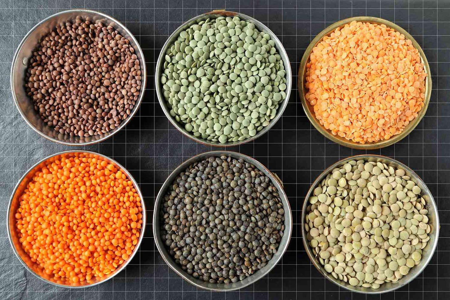 different types of lentils on grid surface