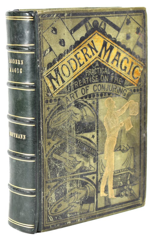 An old leatherbound magic book with a green faded front cover