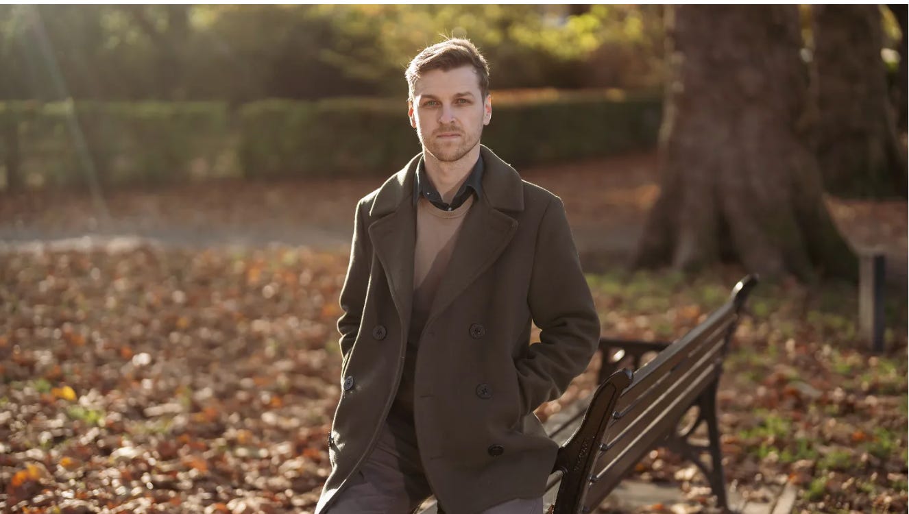 A person standing on a bench

Description automatically generated
