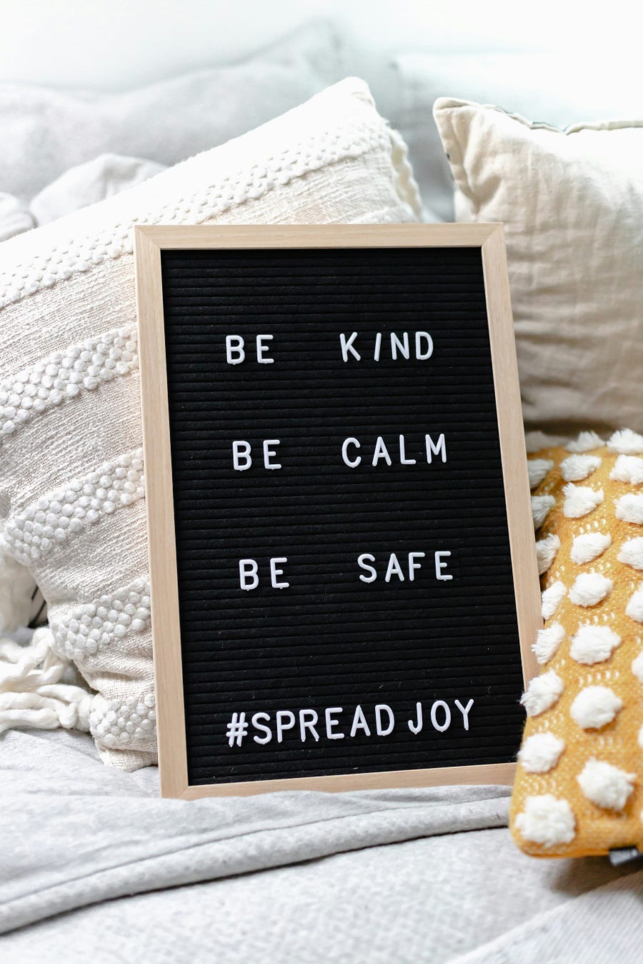 Board with the words, “Be Knd, Be Calm, bE sAFE” Board with the words, “Be Knd, Be Calm, bE sAFE”