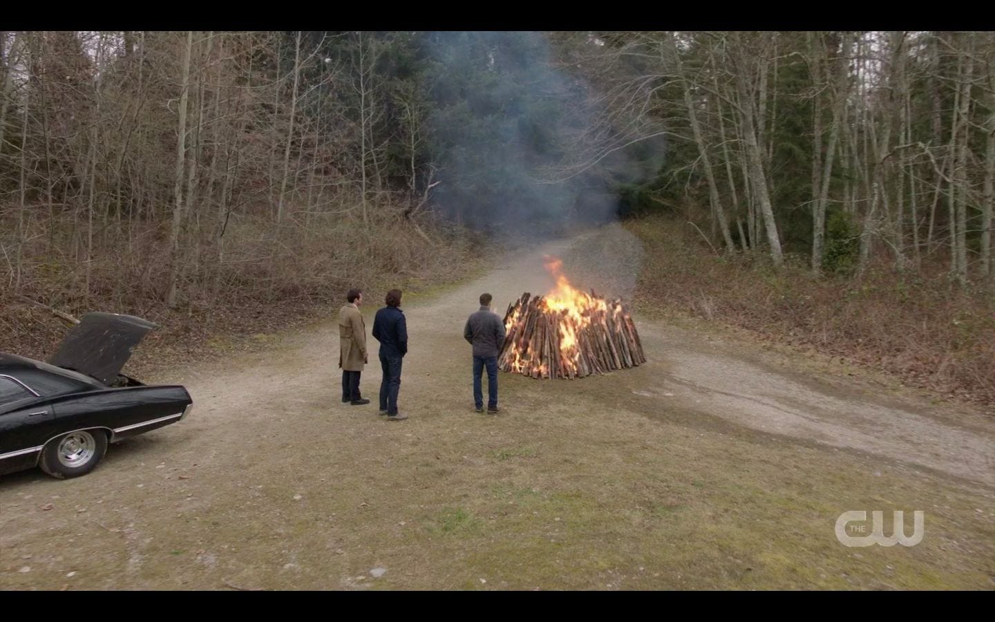 Sam Dean Winchester with castiel as bonfire burns Supernatural Absence