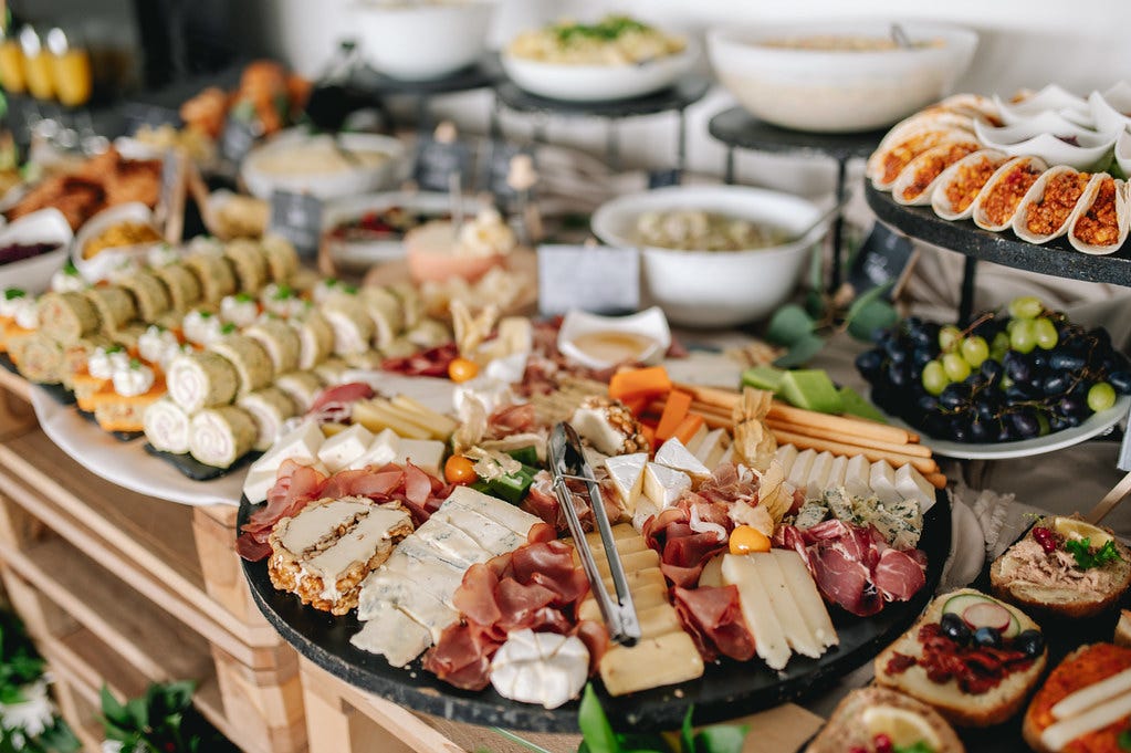 Buffet table with smoked meat and cheese plate, appetizers… | Flickr