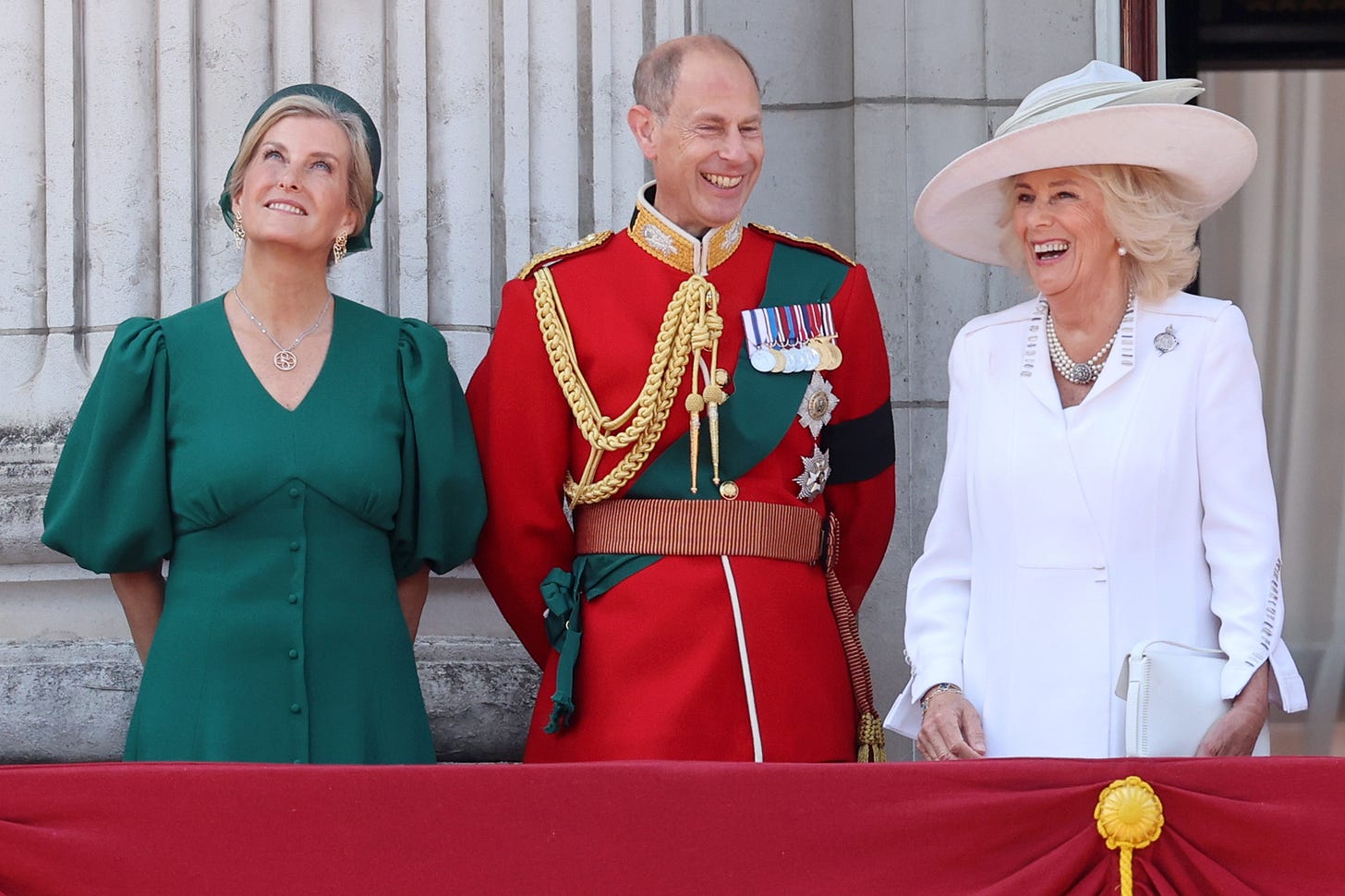 Duke and Duchess of Edinburgh standing next to Queen Camilla on balcony