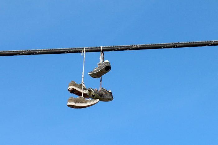 Why Do People Throw Shoes on Power Lines? 9 Theories Explained
