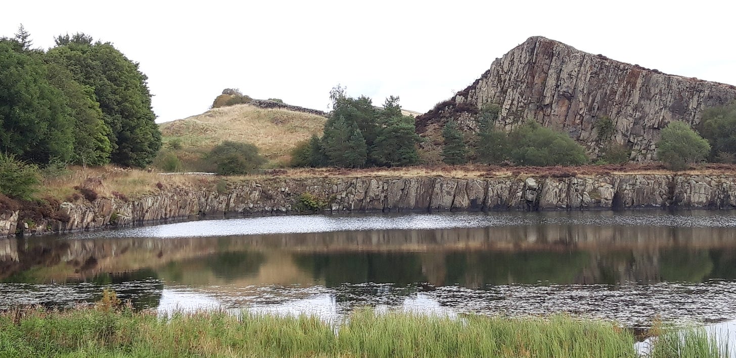 Cowfield Quarry with Hadrian's Wall in the background.