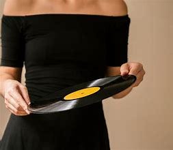 Image result for holding an LP record