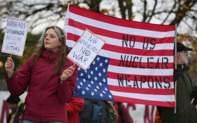 A protester campaigns against nuclear weapons outside RAF Lakenheath in 2022 when it was reported that US warheads could make a return to British soil
