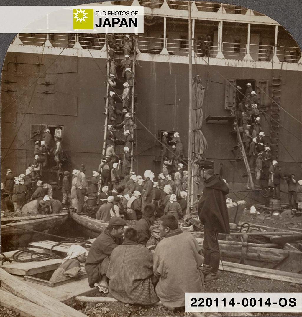 Japanese harbor workers load coal onto a ship in Nagasaki, 1905