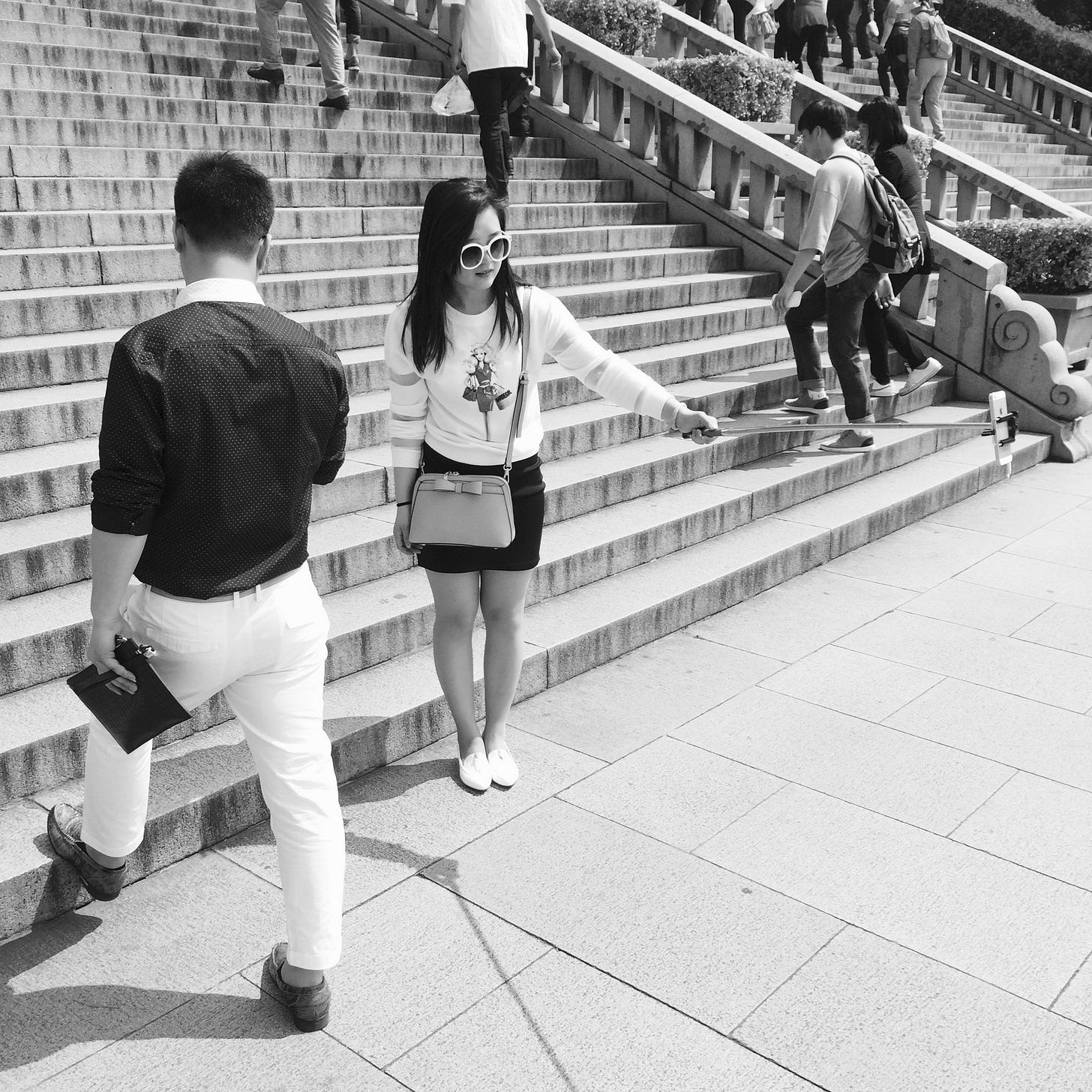Tourist taking a selfie on the steps leading to Dr. Sun Yat-sen’s mausoleum in Nanjing.