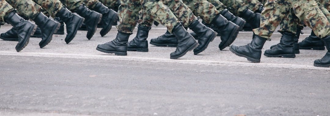 men in green and brown camouflage uniform