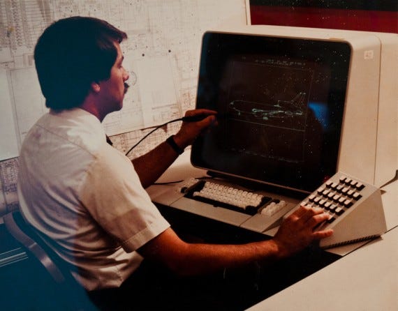 Man Operating a Vintage Computer