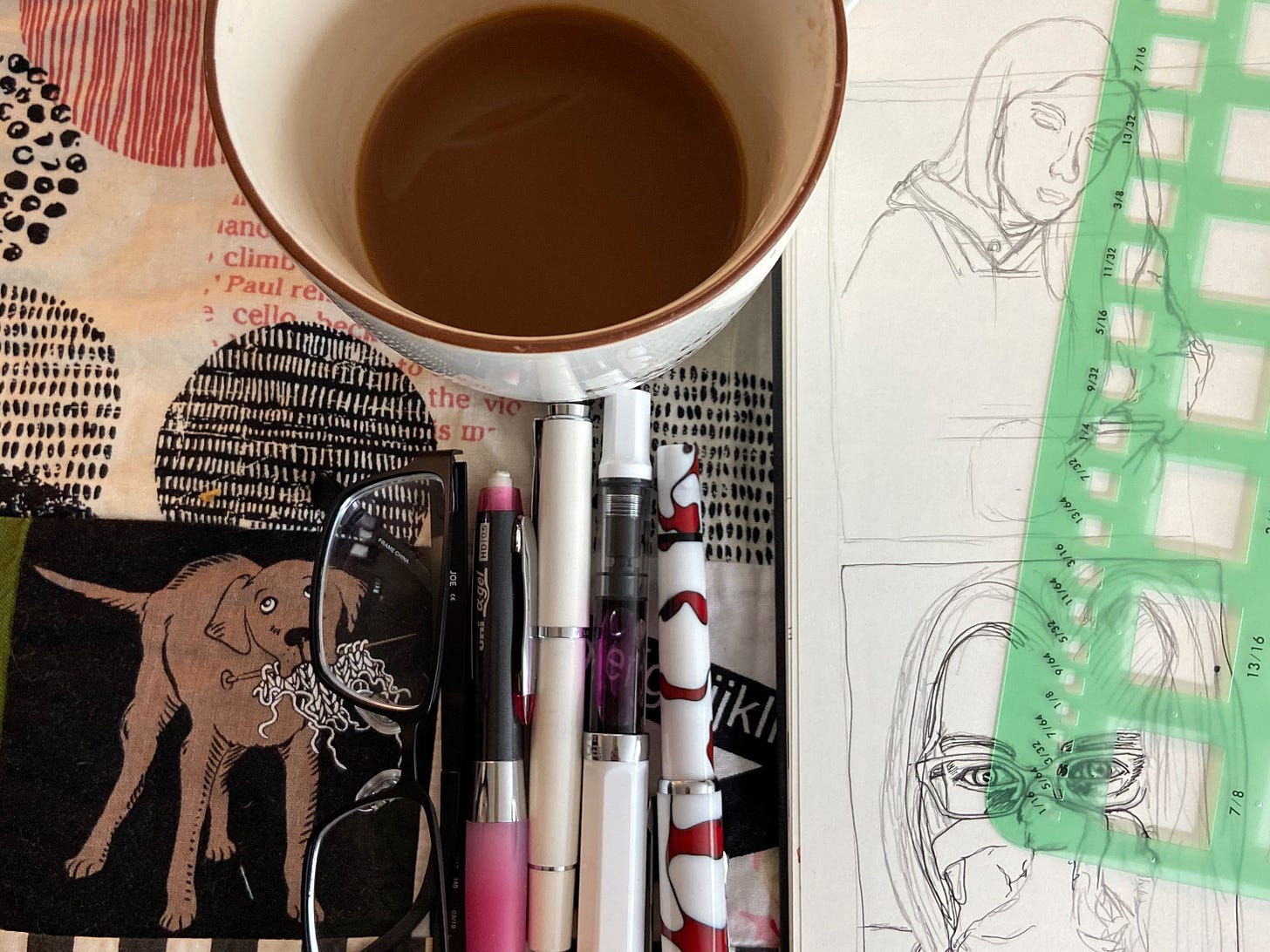Sketchbook, coffee, and pens