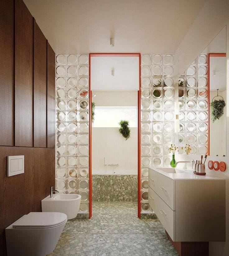 This may contain: a bathroom with two toilets and a sink in the middle, surrounded by wood paneling This may contain: a bathroom with two toilets and a sink in the middle, surrounded by wood paneling