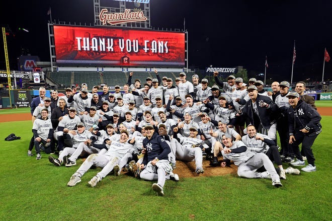 Oct 19, 2024; Cleveland, Ohio, USA; The New York Yankees celebrates after beating the Cleveland Guardians during game five of the ALCS for the 2024 MLB playoffs at Progressive Field. Mandatory Credit: Scott Galvin-Imagn Images