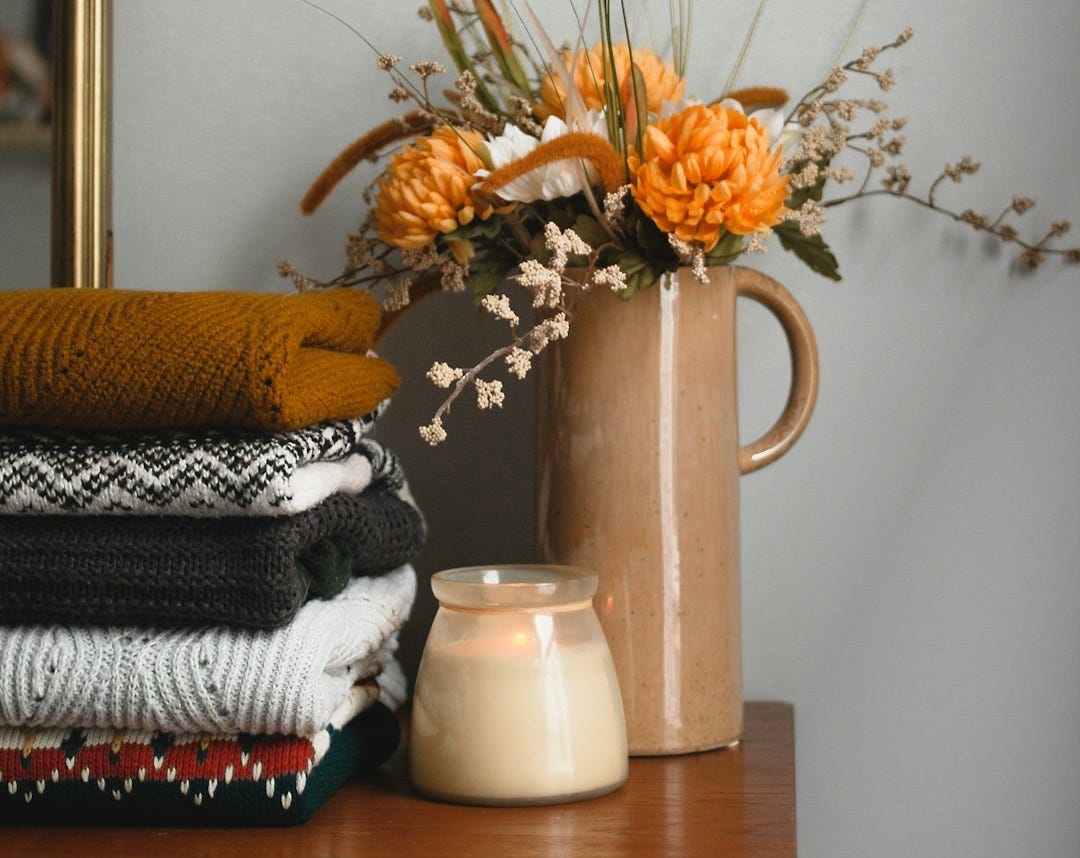 yellow flowers in white ceramic vase