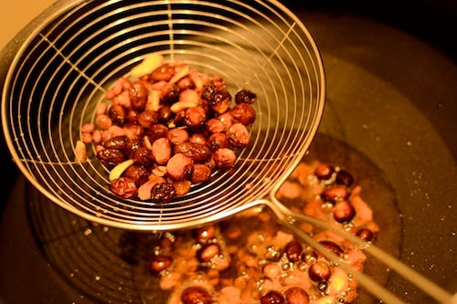 Fry Cashews, almonds and raisins  the oil from the dry fruits