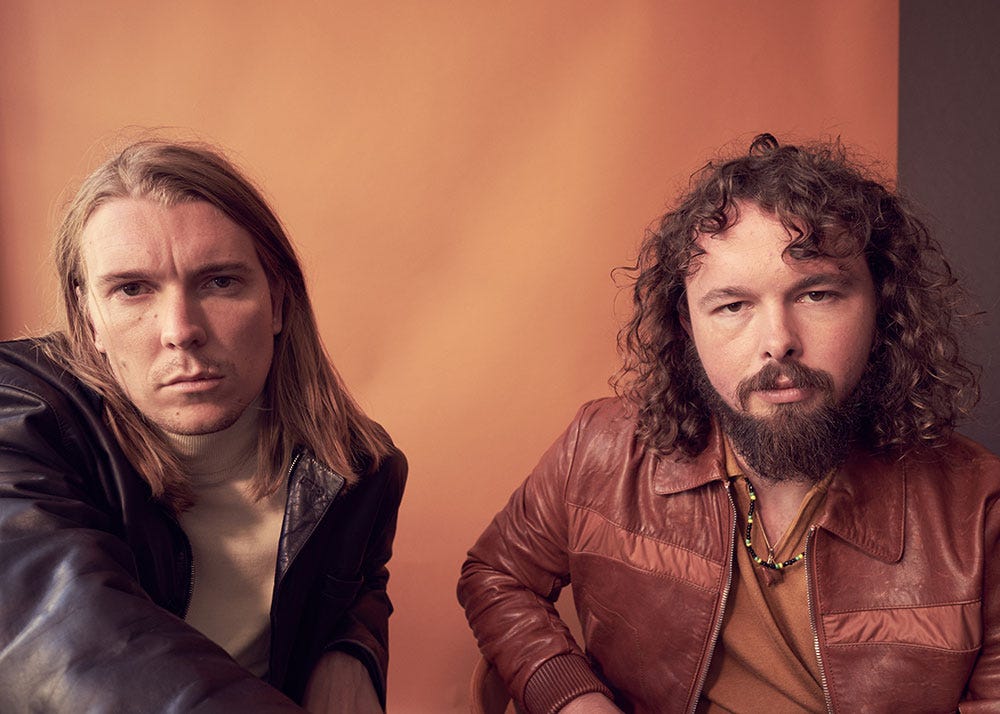 Colored photo of musicians Alex Cameron and Roy Molloy by JackO’Connor for MONROWE Magazine