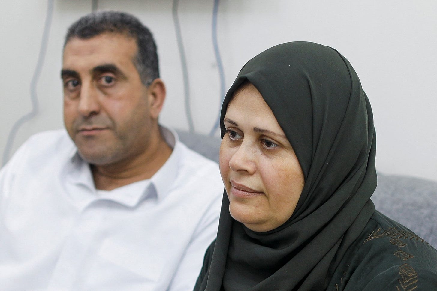 Palestinian woman Najwa Abu Hamada, whose IVF embryos were stored at the Al-Basma IVF Centre, Gaza's largest fertility clinic, which was struck by an Israeli shell during the ongoing conflict, sits next to her husband during an interview, Doha, Qatar, March 25, 2024. (Reuters Photo)
