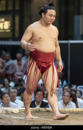 Tokyo, Japan. 25th Aug, 2019. A sumo wrestler Enho Akira participates in a  special Grand Sumo Tournament during the ''Hakkiyoi KITTE'' event held at  KITTE commercial complex. Every year, visitors came to