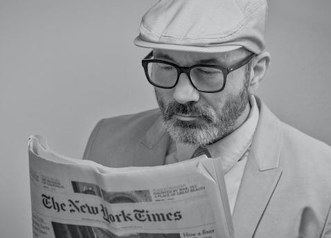 Man reading the New York Times